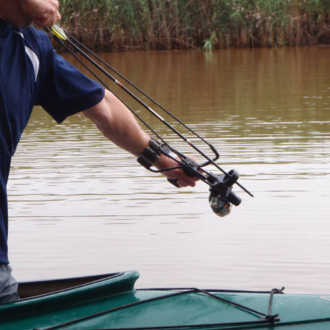 Man fishing with slingshot